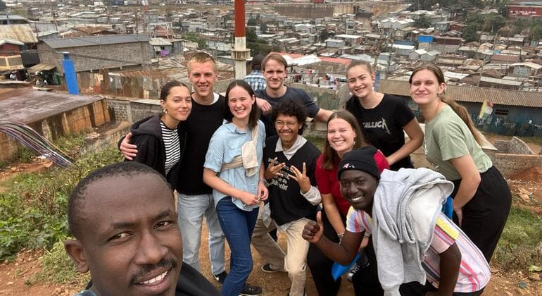 Guests walking through Kibera with a local guide